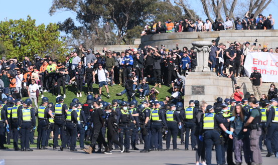 Anti-lockdown protesters face off with Victoria Police at the Shrine of Remembrance in Melbourne on Wednesday.
