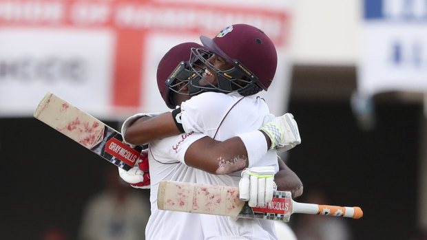 West Indies' John Campbell and Kraigg Brathwaite celebrate after hitting the winning runs on day three.