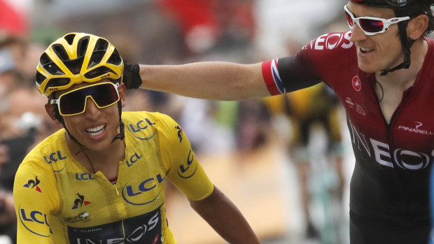 Britain's Geraint Thomas, right, congratulates Colombia's Egan Bernal wearing the overall leader's yellow jersey.