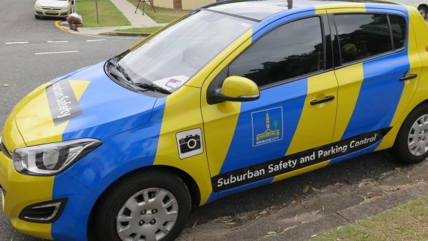 A Brisbane City Council parking officer fined two cars within two minutes, despite them both having paid for parking.