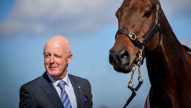 Legendary racecaller Greg Miles with champion horse Might And Power last year.