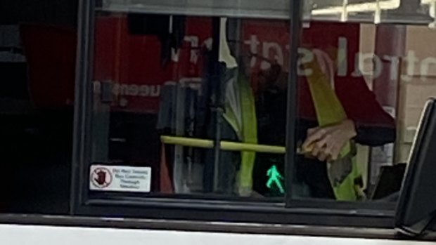 Police forensic crash unit experts photograph a Brisbane City Council bus as it travels from Ann Street into Edward Street as part of the investigation.