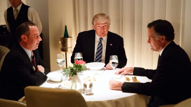 Happier times: then President-elect Donald Trump dines with Mitt Romney and then chief of staff Reince Priebus in November 2016.