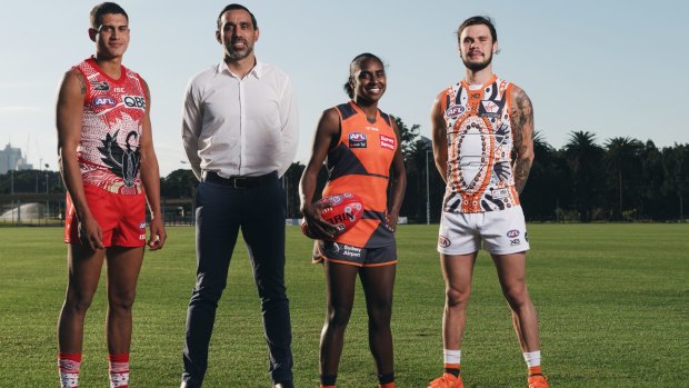 Goodes recently, with James Bell from the Swans, Delma Gisu from the Giants AFLW and Zac Williams from the Giants.