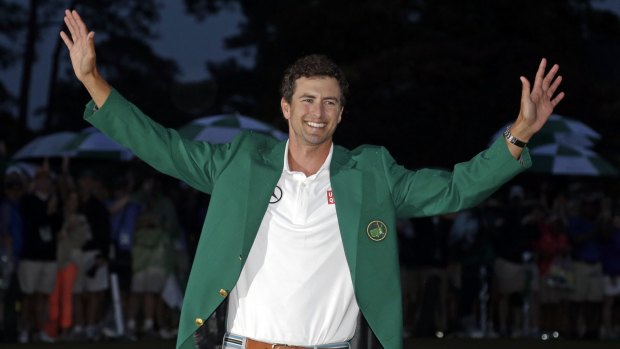 Adam Scott shows off his green jacket after winning the Masters in 2013.