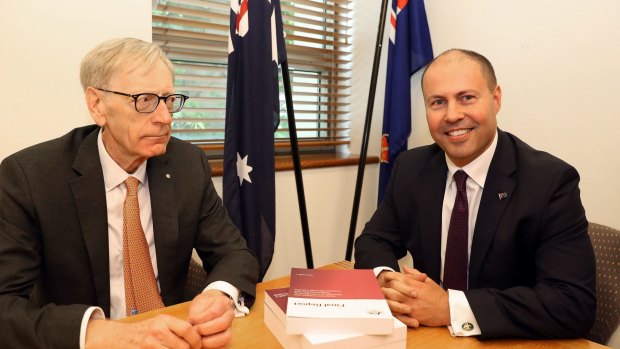 Commissioner Kenneth Hayne and Treasurer Josh Frydenberg with the final report from the royal commission.
