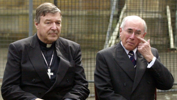Cardinal George Pell and then prime minister John Howard at a media call at St Benedict's Church in August 2004.