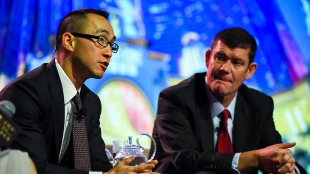 Melco boss Lawrence Ho (left) and James Packer. Mr Ho sold his stake in Crown Resorts in April.