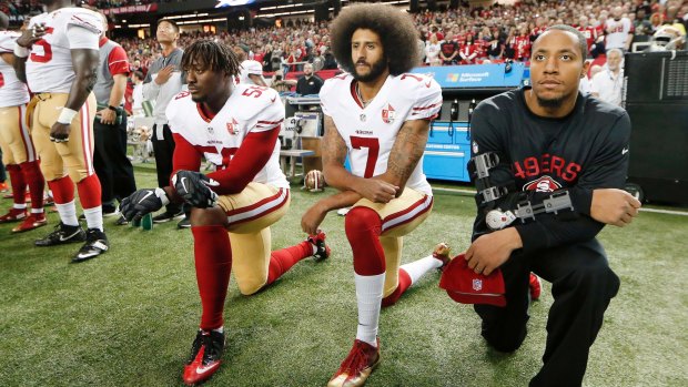 NFL players kneeling during the anthem to raise awareness of racism and social injustice.