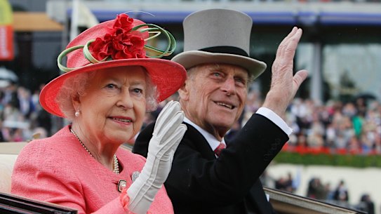 FILE - In this Thursday, June, 16, 2011 file photo Britain's Queen Elizabeth II with Prince Philip arrive by horse drawn carriage in the parade ring on the third day, traditionally known as Ladies Day, of the Royal Ascot horse race meeting at Ascot, England. Britain's Prince Philip on Wednesday Aug. 2, 2017 retires from solo official duties. Over the decades he has become renowned for his stalwart support of his wife, Queen Elizabeth II. (AP Photo/Alastair Grant, File)