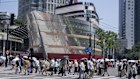 Pedestrians walk by the newly opened Louis Vuitton store shaped like a cruise ship in Shanghai, China.