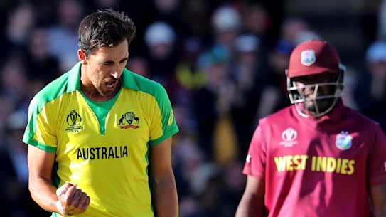 Mitchell Starc celebrates the dismissal of West Indies' captain Jason Holder.