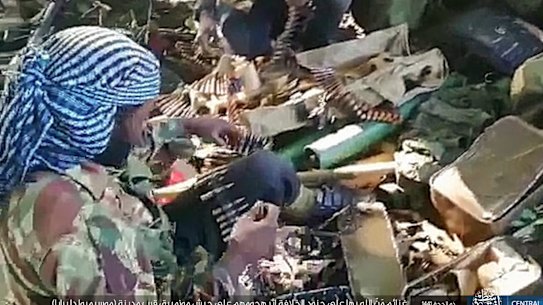 Rebel fighters and weapons after clashes with Mozambique forces last year.