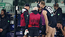 Harry McKay receiving medical attention.