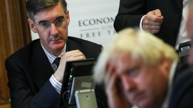 Jacob Rees-Mogg, looks at Boris Johnson, the former UK foreign secretary, earlier this year.