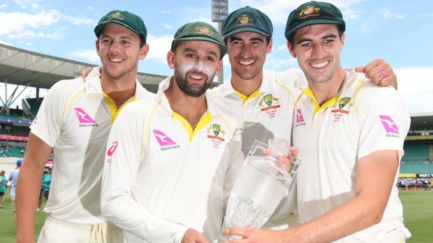 Australia's attack: Josh Hazlewood, Nathan Lyon, Mitchell Starc and Pat Cummins with the Ashes trophy.