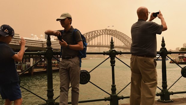 A strong wind change has swept dust over Sydney on Thursday.