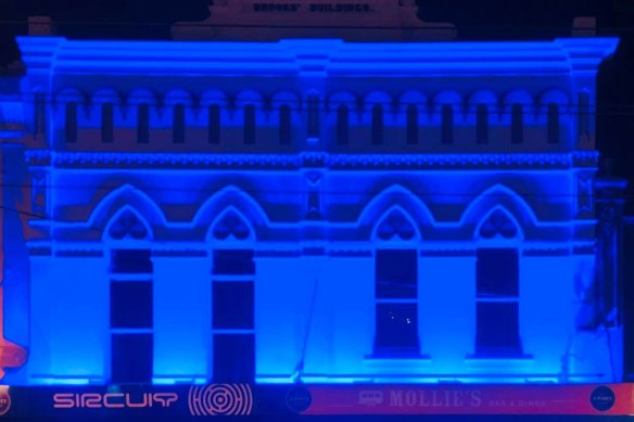 Sircuit bar in Fitzroy bathed in blue as a tribute to the four police officers killed in the Eastern Freeway tragedy. 