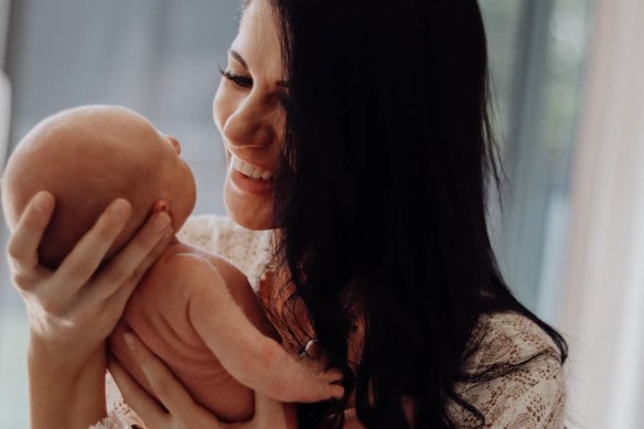 Pilot Ashley Jenkinson’s wife Kosha with their baby in September 2021