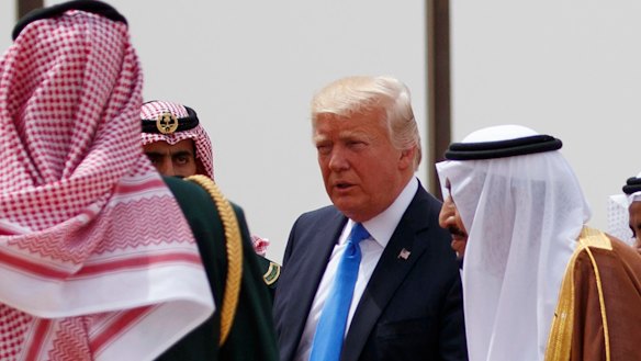 Donald Trump walks with Saudi King Salman, right, during a welcome ceremony in Riyadh. Saudi Arabia was Trump's first overseas destination after becoming president.