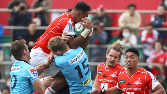 Frequent flyers: Semisi Masirena wins out in a contest for the high ball against Waratahs fullback Bryce Hegarty.