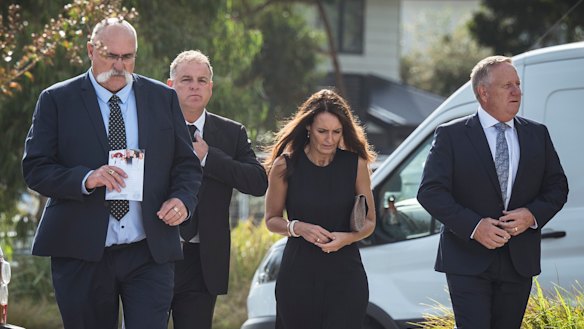 Merv Hughes, Darren Berry and Ian Healy arrive at the service.