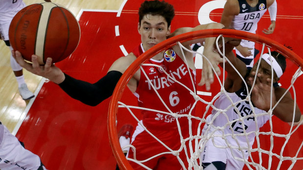 Direct approach: Cedi Osman drives to basket against Myles Turner of USA.