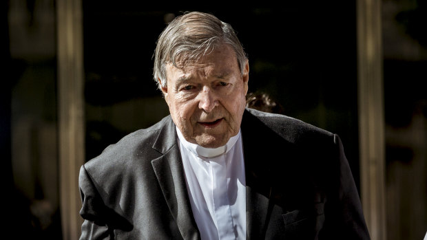 Cardinal George Pell leaves court after being found guilty in December of  sexually assaulting two choirboys in 1996.
