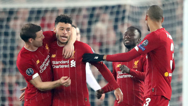 The Reds gather around Alex Oxlade-Chamberlain after he scored the match-winner against Genk at Anfield.