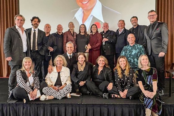 Attendees at the memorial for Johnny Young on Sunday. From left (standing rear): Tim Nelson, Vince Deltito, Steven Zammit, Greg Poynton, Karen Knowles, Anna and Fleur Young, Mark McCormack, Robert McCullough, Joey Dee and Beven Addinsall. Front: Nicole Cooper, Debbie Hancock, Joey Perrone, Tina Arena, Lorena Novoa, Dannii Minogue, Jamie Churchill  and Rikki Arnot. 