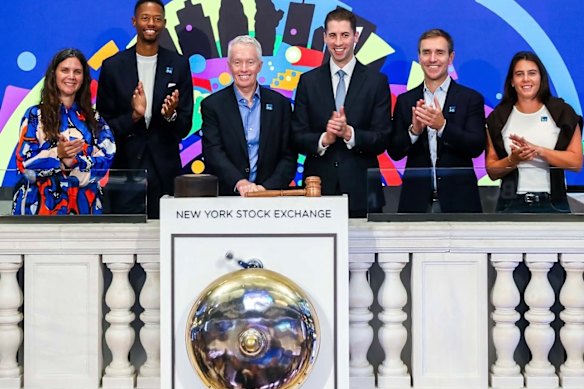 Craig Tiley rings the bell at the New York Stock Exchange.