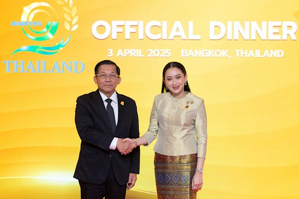 Myanmar’s junta leader Senior General Min Aung Hlaing, left, shakes hands with Thai Prime Minister Paetongtarn Shinawatra on Friday.