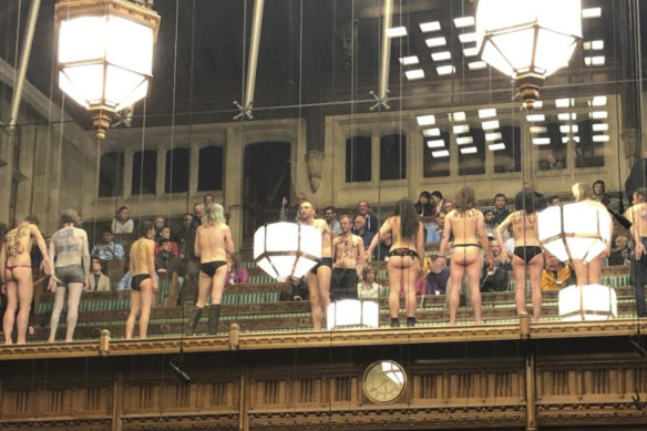 Naked activists glued themselves to the glass in the House of Commons in London in April.