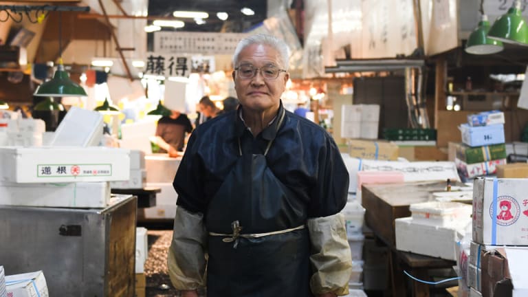 Mikio Wachi, 73, who has run a tuna wholesaler for 48 years and opposed the relocation of Tsukiji, the famed wholesale seafood market in Tokyo, pictured on the last day on Saturday. 