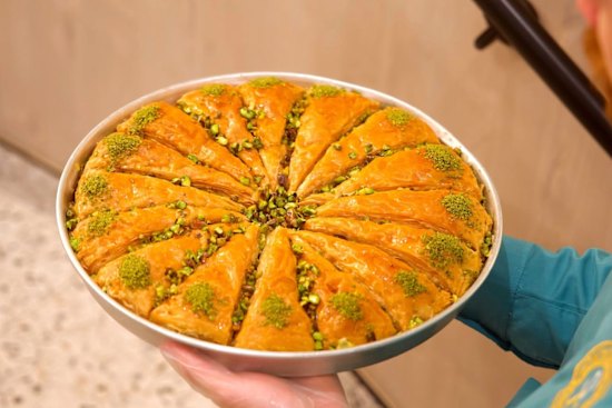 Carrot slice triangle baklava with pistachio.