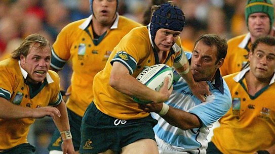 Stephen Larkham makes a break when Australia last hosted a Rugby World Cup in 2003.