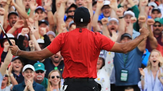 Tiger Woods celebrates after sinking his winning putt at Augusta to win the US Masters in April.