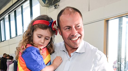 Josh Frydenberg voting in Kooyong with his wife Amie and their children Gemma and Blake.