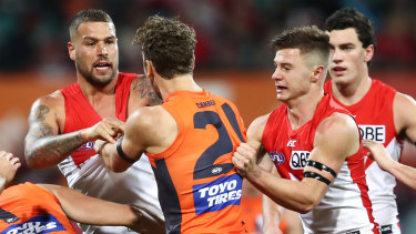 Always a Swan? Lance Franklin scraps with a Giant this year.