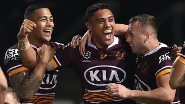 TC Robati (centre) celebrates after scoring a try against the St George Illawarra Dragons in Sydney on June 3.