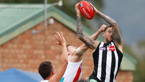 High flier: Magpie Jeremy Howe takes a trademark screamer during a pre-season match at Morwell. 