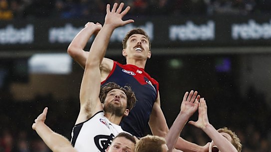 MELBOURNE, AUSTRALIA - MAY 16: Jake Lever of the Demons, Levi Casboult of the Blues, Steven May of the Demons, Harrison Petty of the Demons and Harry McKay of the Blues compete for the ball during the 2021 AFL Round 09 match between the Melbourne Demons and the Carlton Blues at the Melbourne Cricket Ground on May 16, 2021 in Melbourne, Australia. (Photo by Dylan Burns/AFL Photos via Getty Images)