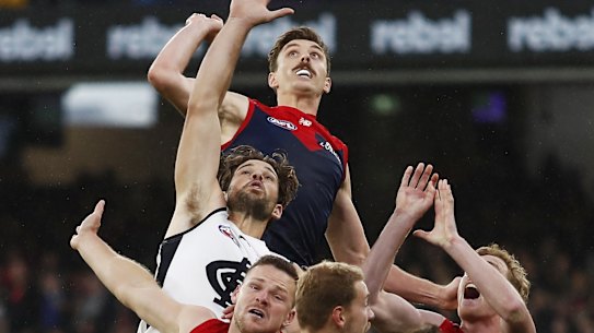 MELBOURNE, AUSTRALIA - MAY 16: Jake Lever of the Demons, Levi Casboult of the Blues, Steven May of the Demons, Harrison Petty of the Demons and Harry McKay of the Blues compete for the ball during the 2021 AFL Round 09 match between the Melbourne Demons and the Carlton Blues at the Melbourne Cricket Ground on May 16, 2021 in Melbourne, Australia. (Photo by Dylan Burns/AFL Photos via Getty Images)
