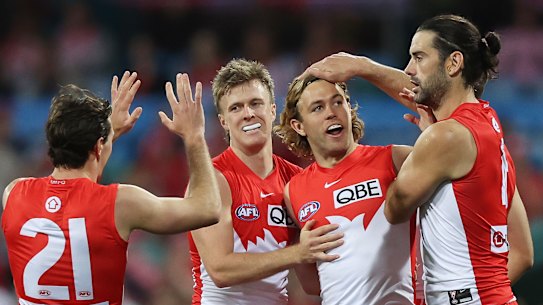 James Rowbottom of the Swans celebrates kicking a goal.