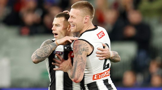 Jamie Elliott celebrates a goal with Jordan De Goey.