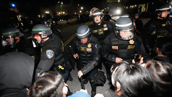 Police advance on pro-Palestinian demonstrators in an encampment on the UCLA campus in Los Angeles.