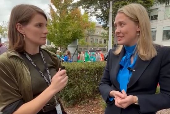 Rachael Dexter interviewing Liberal Kooyong candidate Amelia Hamer at a pre-poll voting centre this week.
