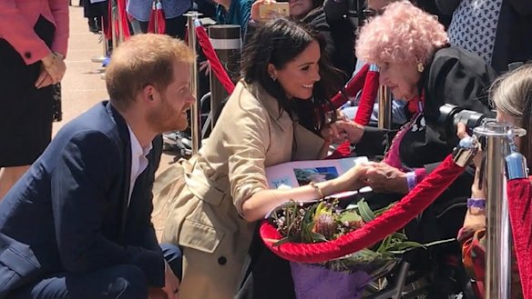 Britain's Prince Harry, the Duke of Sussex and his wife Meghan, the Duchess of Sussex meet with 98 year-old Daphne Dunne.