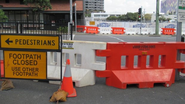 The footpath and pedestrian signals closure has sparked safety concerns.