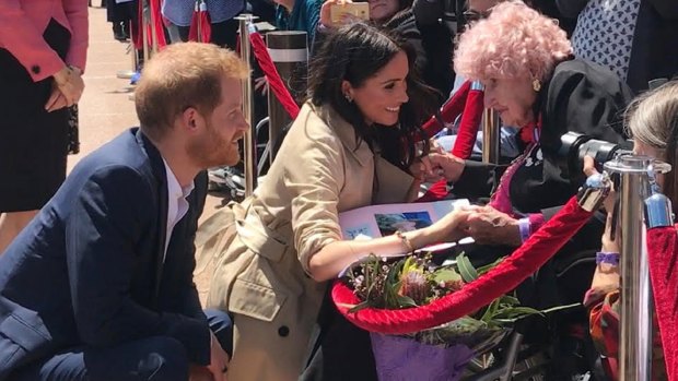 Britain's Prince Harry, the Duke of Sussex and his wife Meghan, the Duchess of Sussex meet with 98 year-old Daphne Dunne.